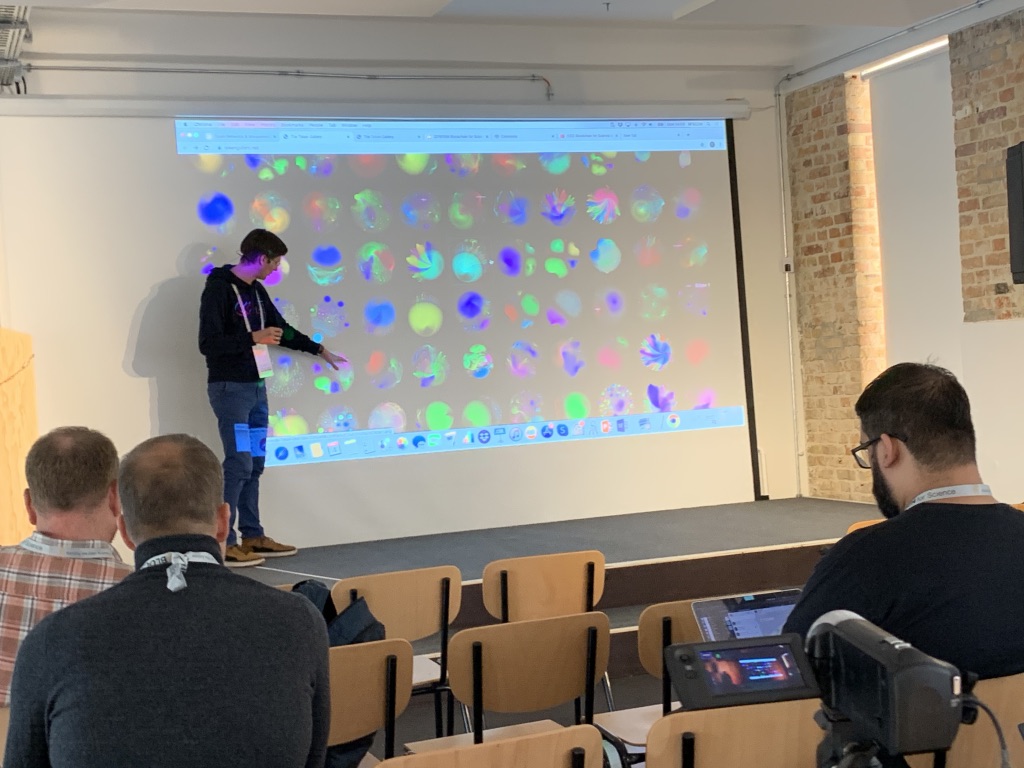 Speaker presenting data visualizations